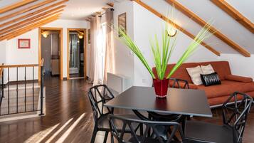 Apartment, 1 Bedroom, Terrace, Sea View | Living area | 43-inch Smart TV with satellite channels, TV, iPod dock