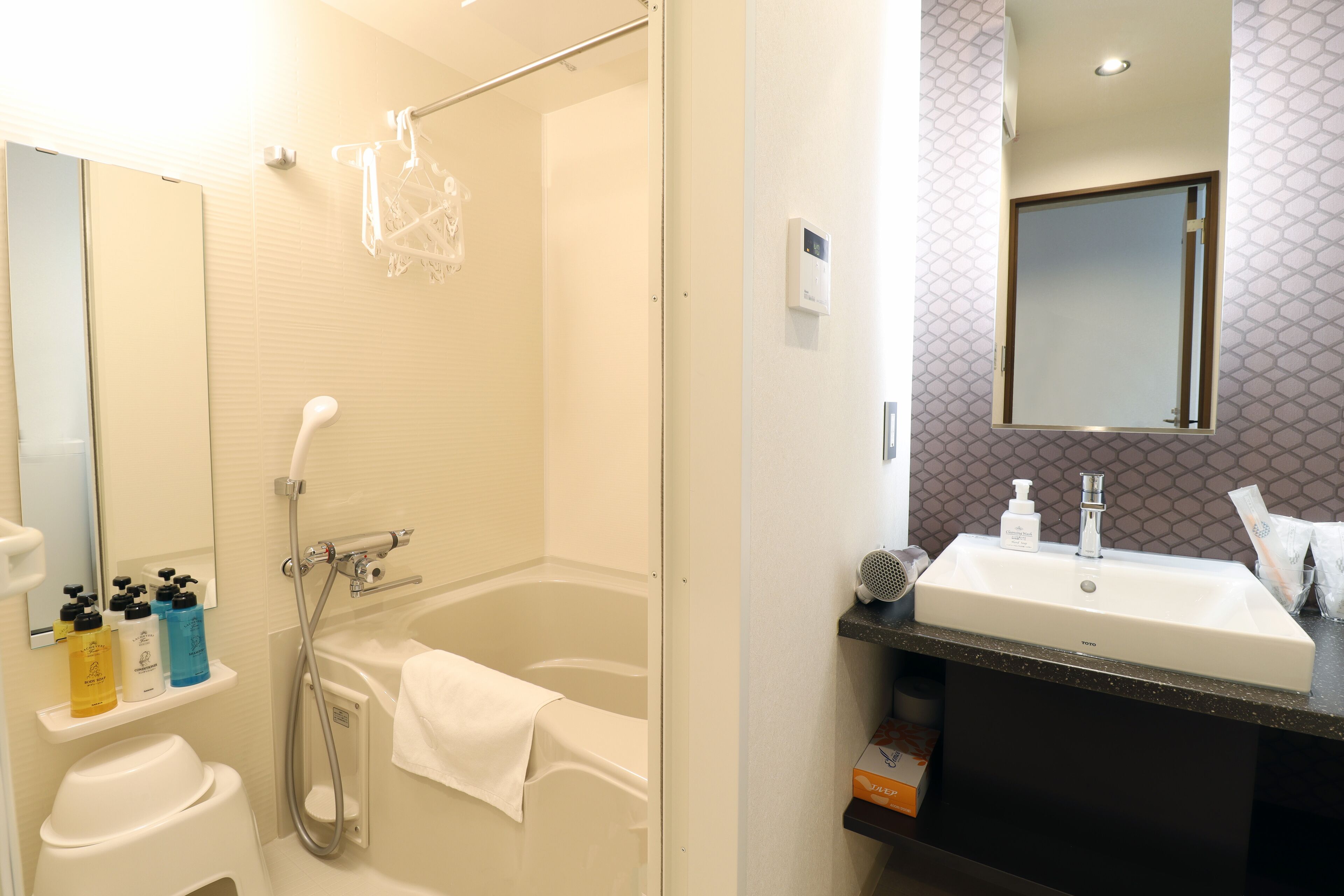 Combined shower/tub, free toiletries, hair dryer, slippers