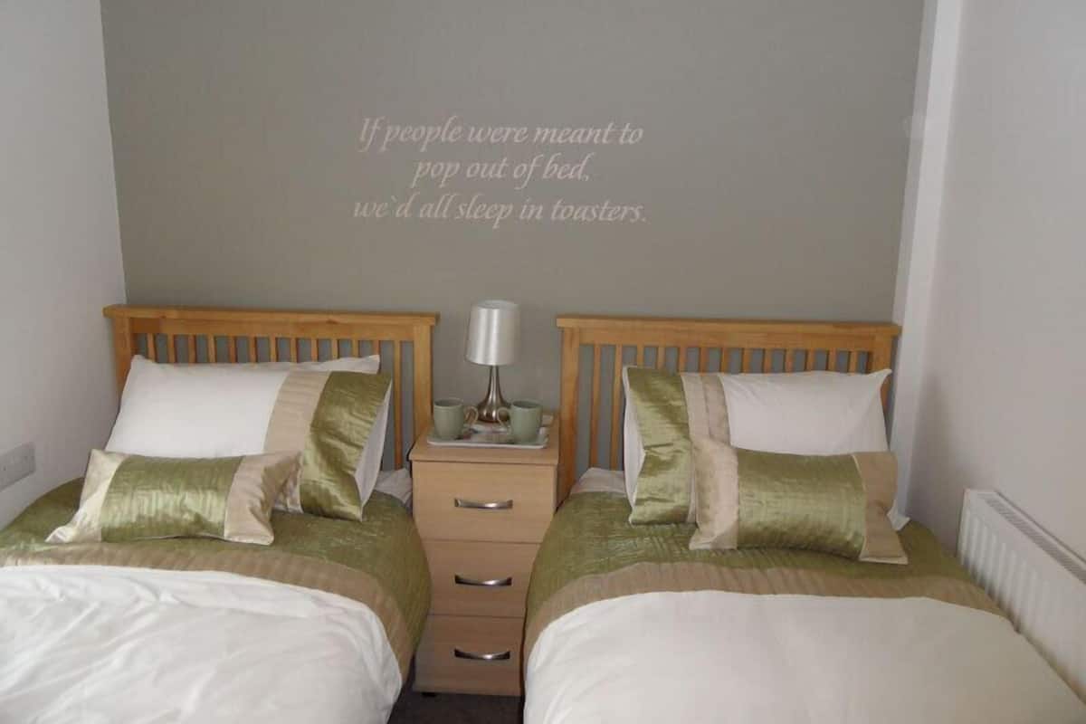Twin Room | Iron/ironing board (on request), WiFi (free), individually decorated