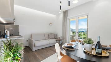 Deluxe Apartment (Gold) | Living area | Smart TV