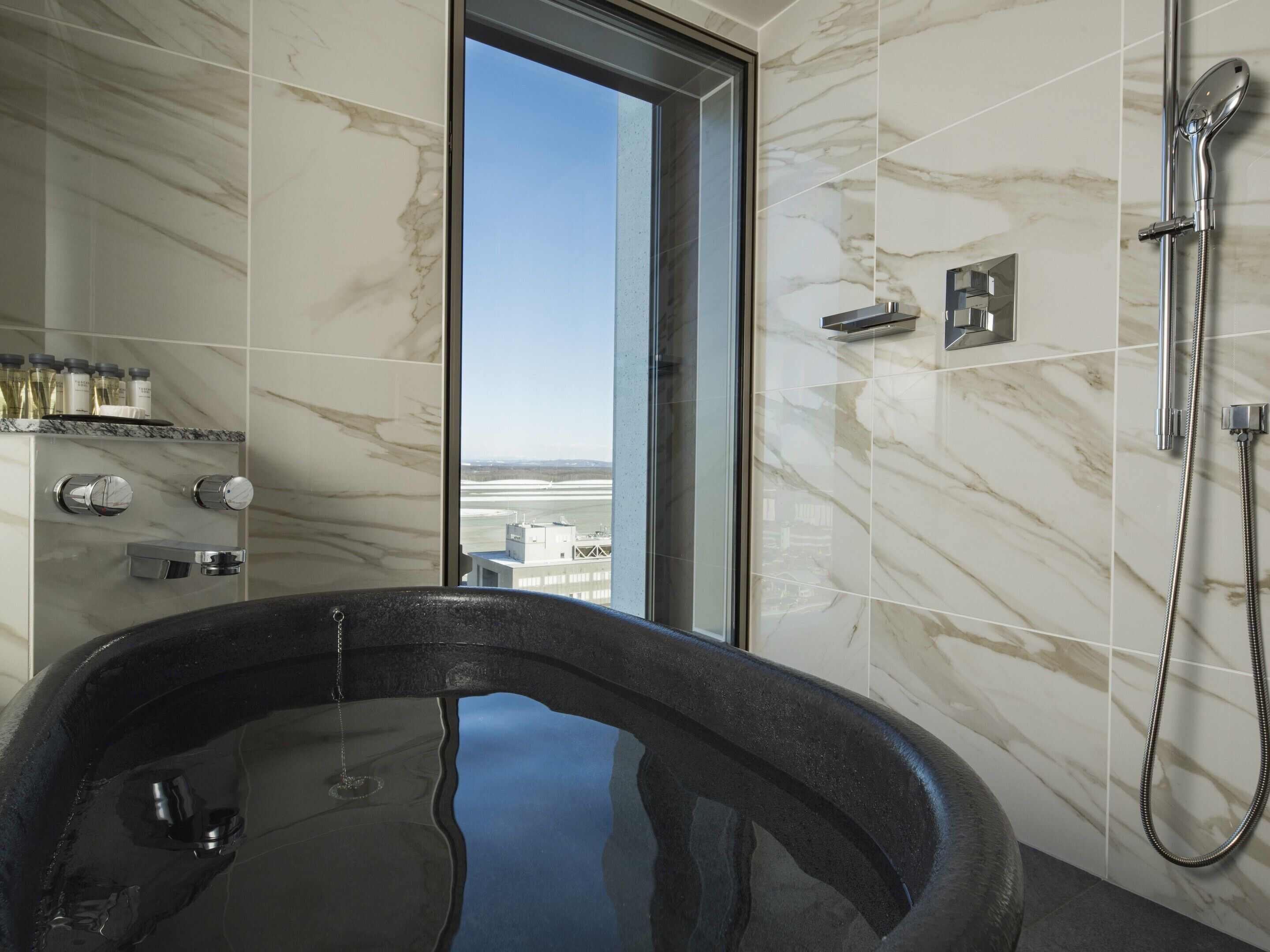 portom suite room | bathroom | separate bathtub and shower, free toiletries, hair dryer, bathrobes