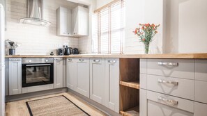 The Old Tractor Shed | Private kitchen | Full-size fridge, microwave, oven, stovetop - Village Farm Cottages. (Driffield)