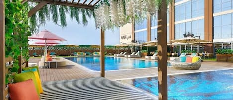 Outdoor pool, pool umbrellas, sun loungers
