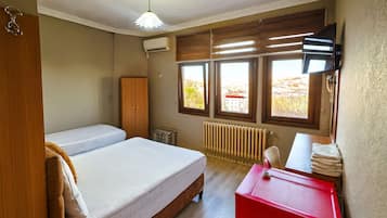 Standard Triple Room, Sea View | Minibar, blackout drapes, soundproofing, iron/ironing board