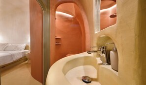 Antinoe Luxury Suite by K&K | Bathroom | Shower, hair dryer, slippers, towels - The A Collection, Oia by K&K (Santorini)