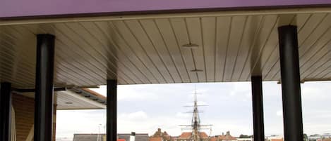 A covered pavilion with a sign for Premier Inn, featuring a nautical theme with a ship and stars.