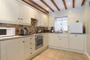 Fridge, microwave, dishwasher, cookware/dishes/utensils