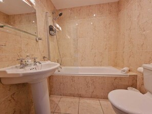 Combined shower/bathtub, hair dryer, towels