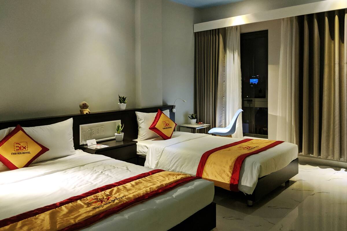 Deluxe Triple Room, City View | Free minibar items, individually decorated, individually furnished, desk