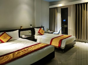 Deluxe Triple Room, City View | Free minibar items, individually decorated, individually furnished, desk