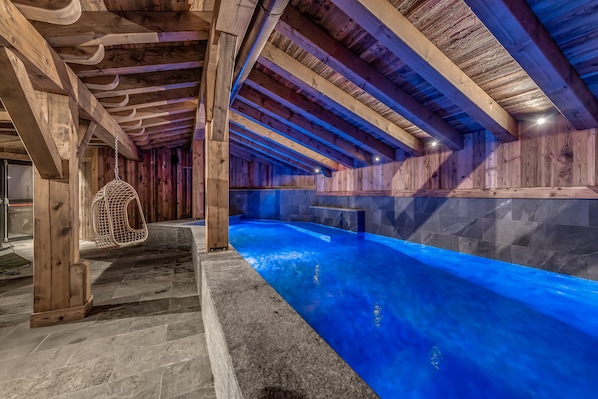 Indoor pool, open 10:00 AM to 8:00 PM, pool loungers