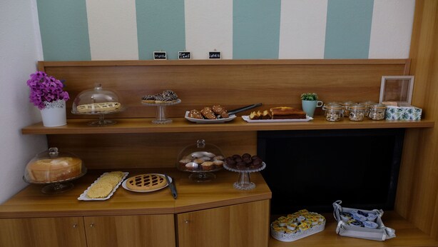 A buffet setup with various desserts on display. - Hotel Pescofalcone (Caramanico Terme)