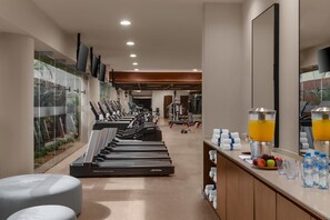 A gym with treadmills, weights, and a juice bar. - Hilton Cancun Mar Caribe All-Inclusive Resort (Cancun)