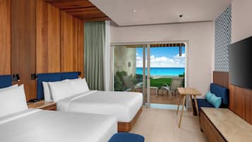 Habitación, 2 camas Queen size, frente al mar (Enclave, Ground Floor) | Edredón, camas con pillow-top y caja de seguridad en la habitación