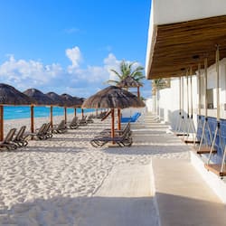 On the beach, white sand, free beach cabanas, sun loungers