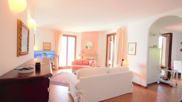 Apartment, 3 Bedrooms | Living area | 48-inch flat-screen TV with cable channels, TV