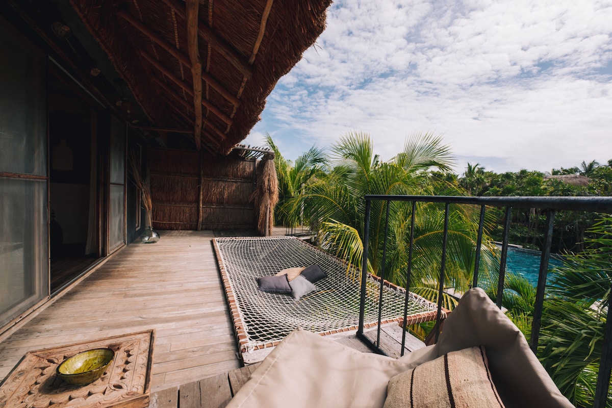 aerial view of Radhoo Tulum pool area surrounded by lush greenery