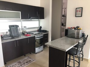 Fridge, microwave, oven, stovetop - PLAYA SUITES II BALCONY  (Carmen)