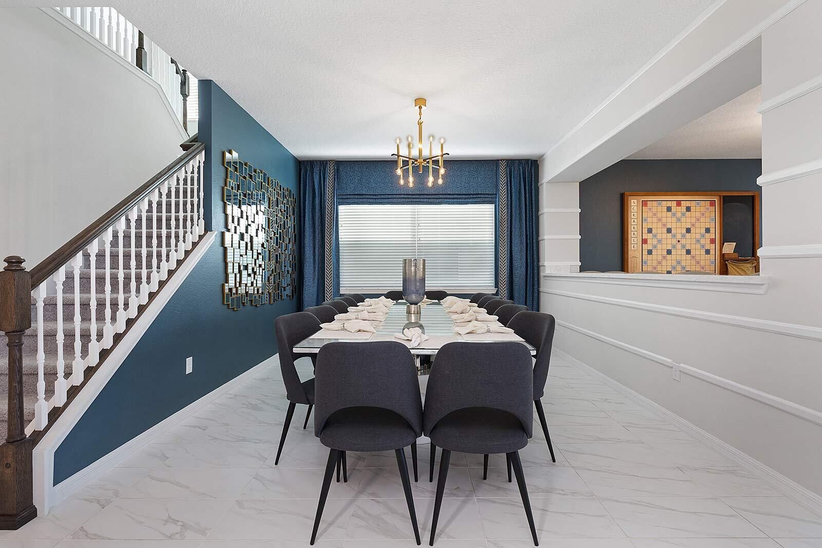 A dining area with a marble floor, a chandelier, and a dining table set for six.