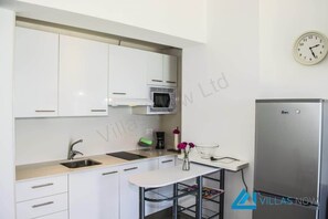 Fridge, microwave, electric kettle, toaster