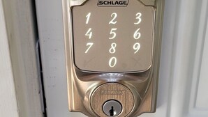 A door with a numeric keypad lock and a round doorknob. - Private Basement Suite Near Rehoboth & Lewes (Rehoboth Beach)