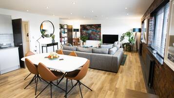 Apartment, 3 Bedrooms | Living area | Flat-screen TV