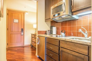 Fridge, microwave, stovetop, coffee/tea maker