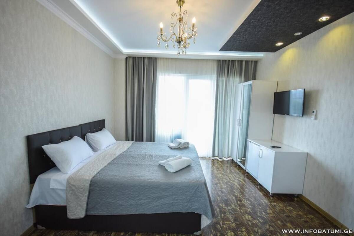 Family Room, Balcony | 1 bedroom, desk, iron/ironing board, free WiFi