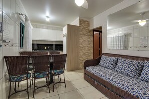 Standard Room, 2 Bedrooms | Living area | 43-inch TV with digital channels - Residencial Flat Gean Guilherme (Florianópolis)