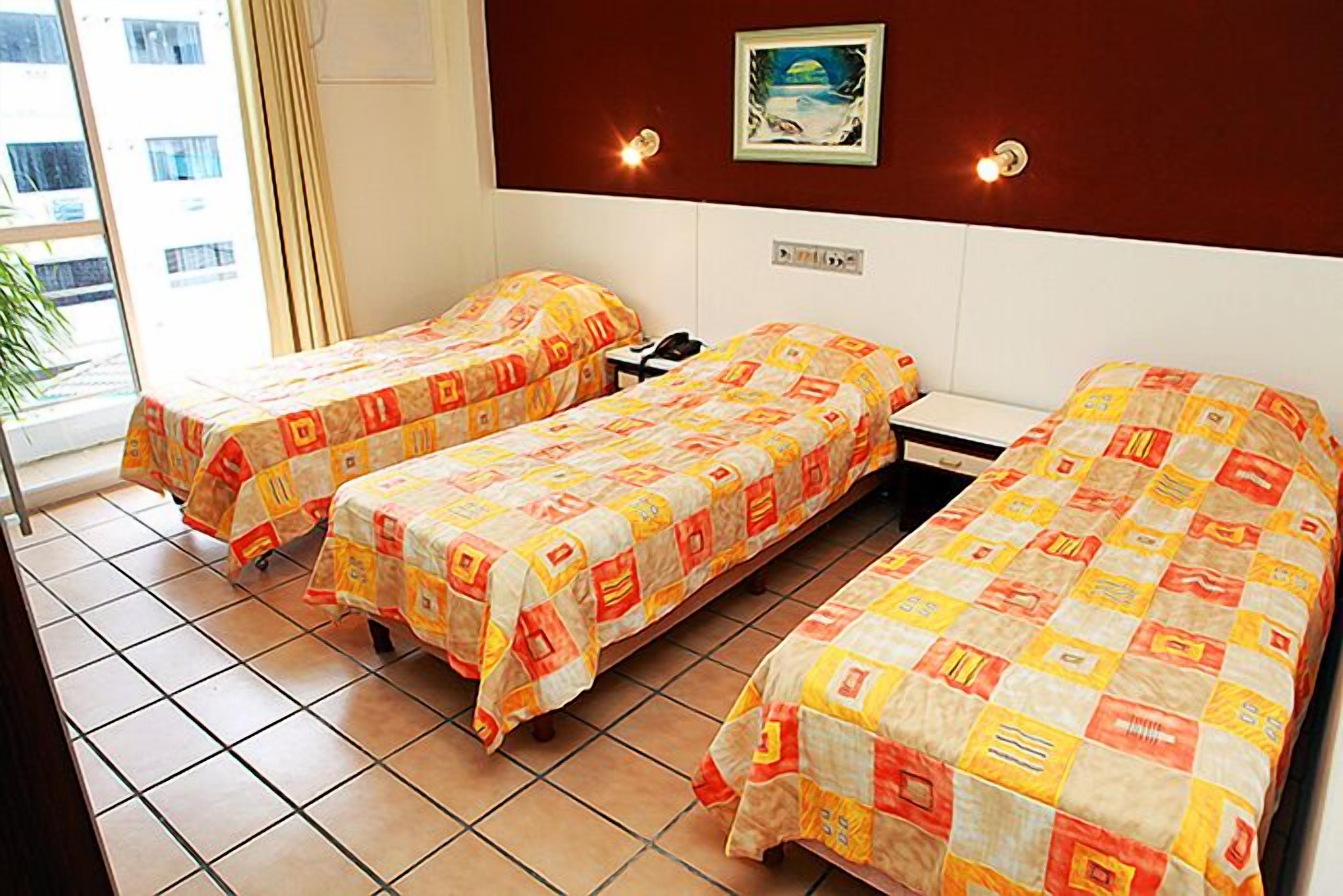 triple room, 3 single beds | minibar, desk, blackout curtains, free wifi