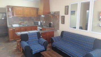 Family Apartment | Living area | 42-inch LED TV with satellite channels, TV