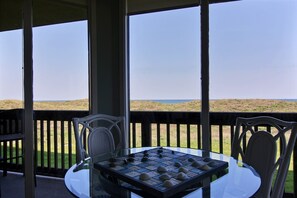 Outdoor dining - Sandpiper Condominiums 102, Panoramic Gulf Views w/ direct access to Mustang Island/Port A beaches. (Port Aransas)