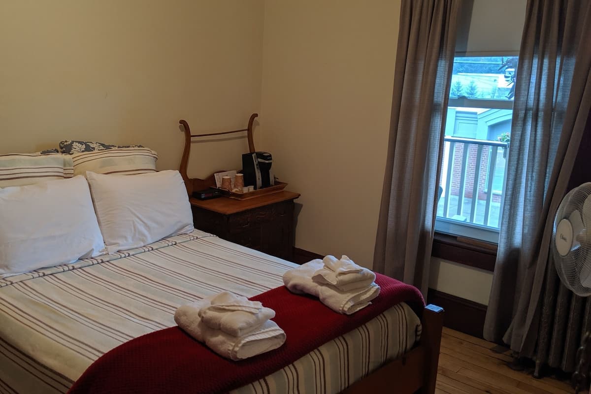 Desk, blackout curtains, iron/ironing board (on request)