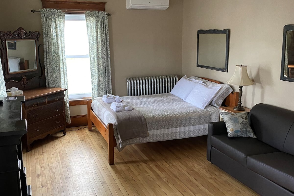 Desk, blackout curtains, iron/ironing board (on request)