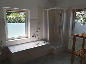 Bathtub, hair dryer, towels, soap