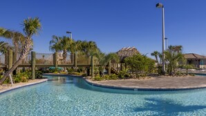 A clear swimming pool with a 3 ft depth marker, surrounded by palm trees and a thatched-roof structure. - Home Away from Home by VillaDirect (Davenport)