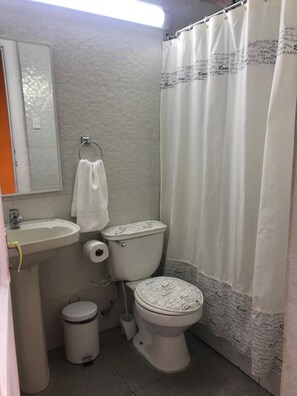 Shower, rainfall showerhead, towels