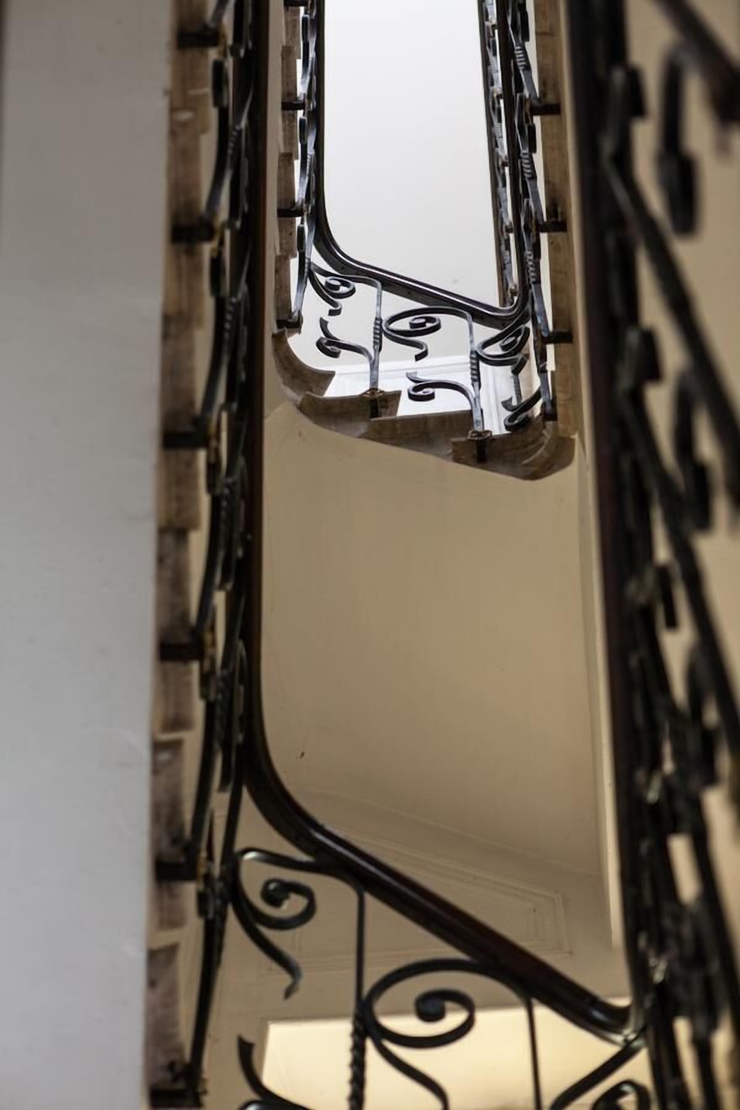 A close-up of a metal railing with intricate designs.