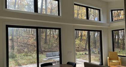 Beautiful new contemporary home, quiet wooded lot minutes from Devils Lake