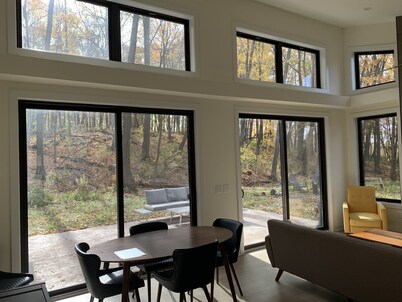 Beautiful new contemporary home, quiet wooded lot minutes from Devils Lake 