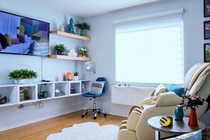 TV, fireplace, books