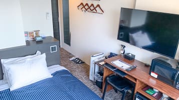 Desk, laptop workspace, free WiFi, bed sheets