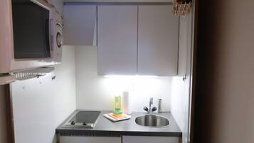 Fridge, microwave, cookware/dishes/utensils