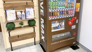A vending machine with a Livemax Hotels & Resorts sign, containing various beverages and snacks. - HOTEL LiVEMAX Nihonbashi Koamicho (Tokyo)