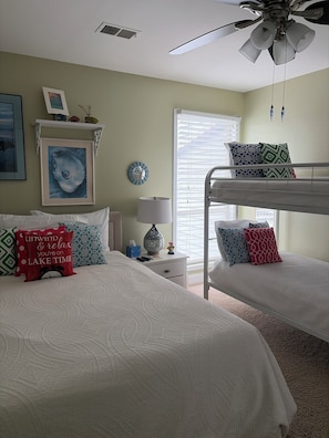 A bedroom with bunk beds, a ceiling fan, a bedside table with a lamp, and a window with blinds. - >>Exceptional Updated Condo w Waterfront Views All Rooms-Walk to Town, Ferry<< (Port Clinton)