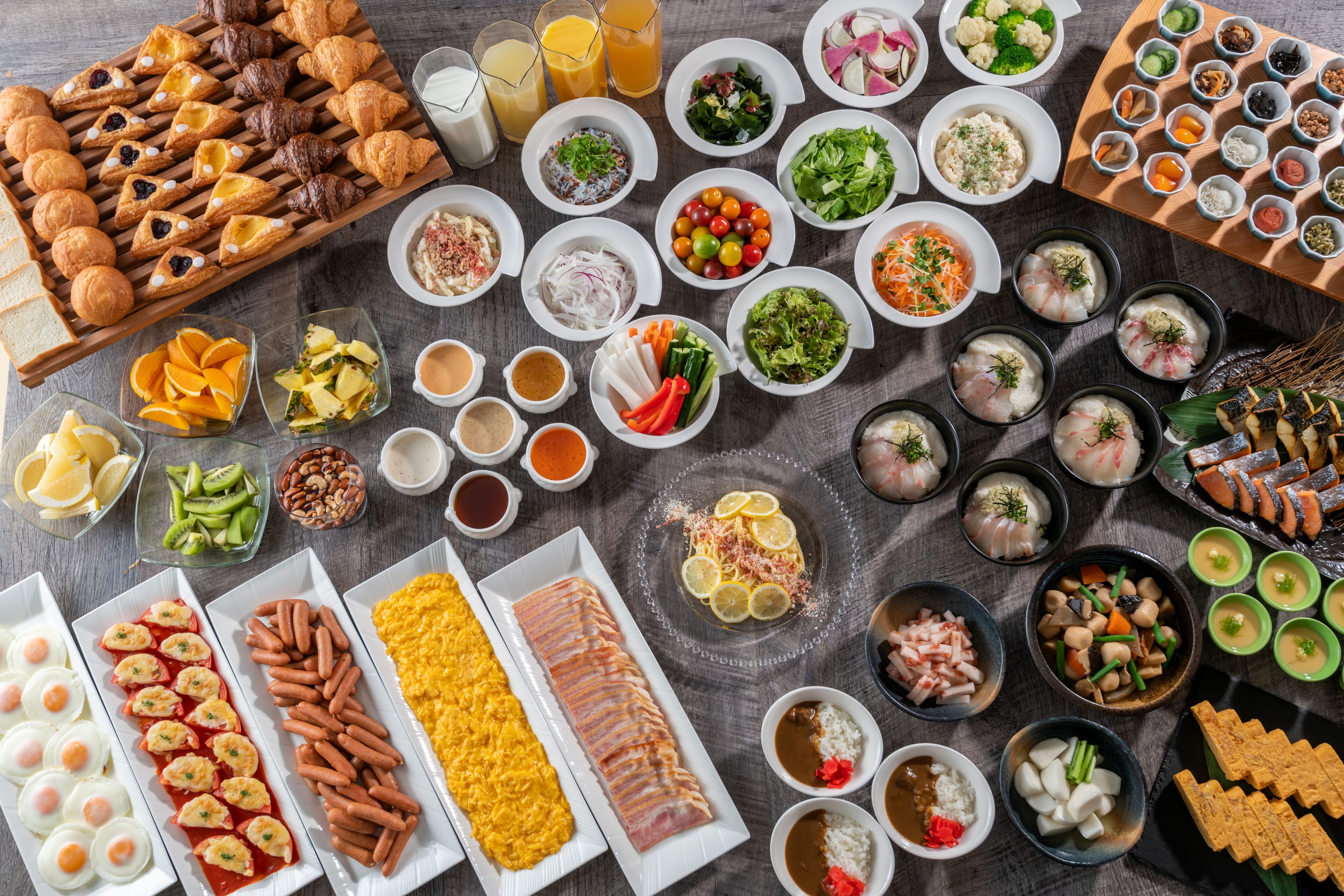 A variety of food items and beverages arranged on a table.