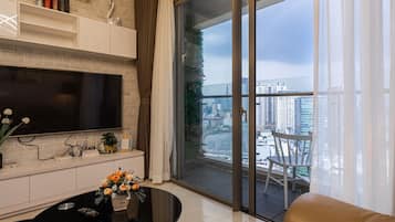 Apartment, 2 Bedrooms | Living area | 50-inch Smart TV with cable channels, TV