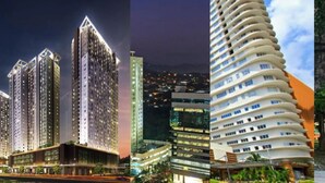 A modern high-rise building with multiple floors, large windows, and a prominent entrance area. - 27th Flr Condo1 w/WIFI @ IT Park Avida Riala Twrs (Cebu City)