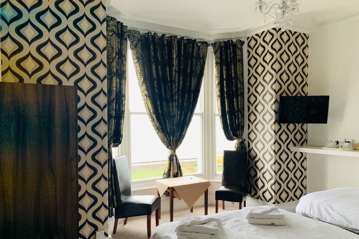 Blackout curtains, iron/ironing board, free WiFi, bed sheets