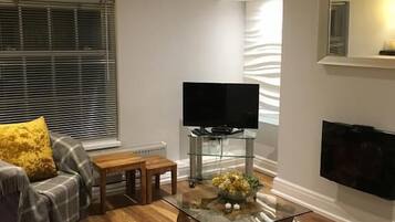 Superior Apartment | Living area | 32-inch Smart TV with digital channels, TV, fireplace